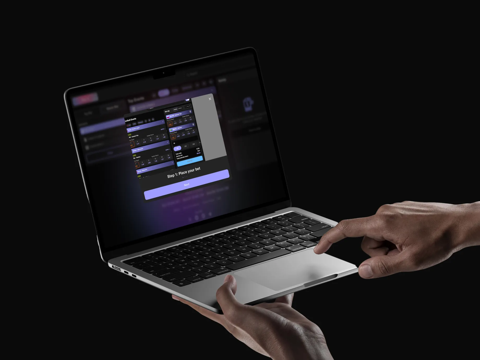 Yez.bet on a laptop held in one hand